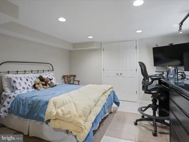a roof deck with table and chairs a barbeque with potted plants