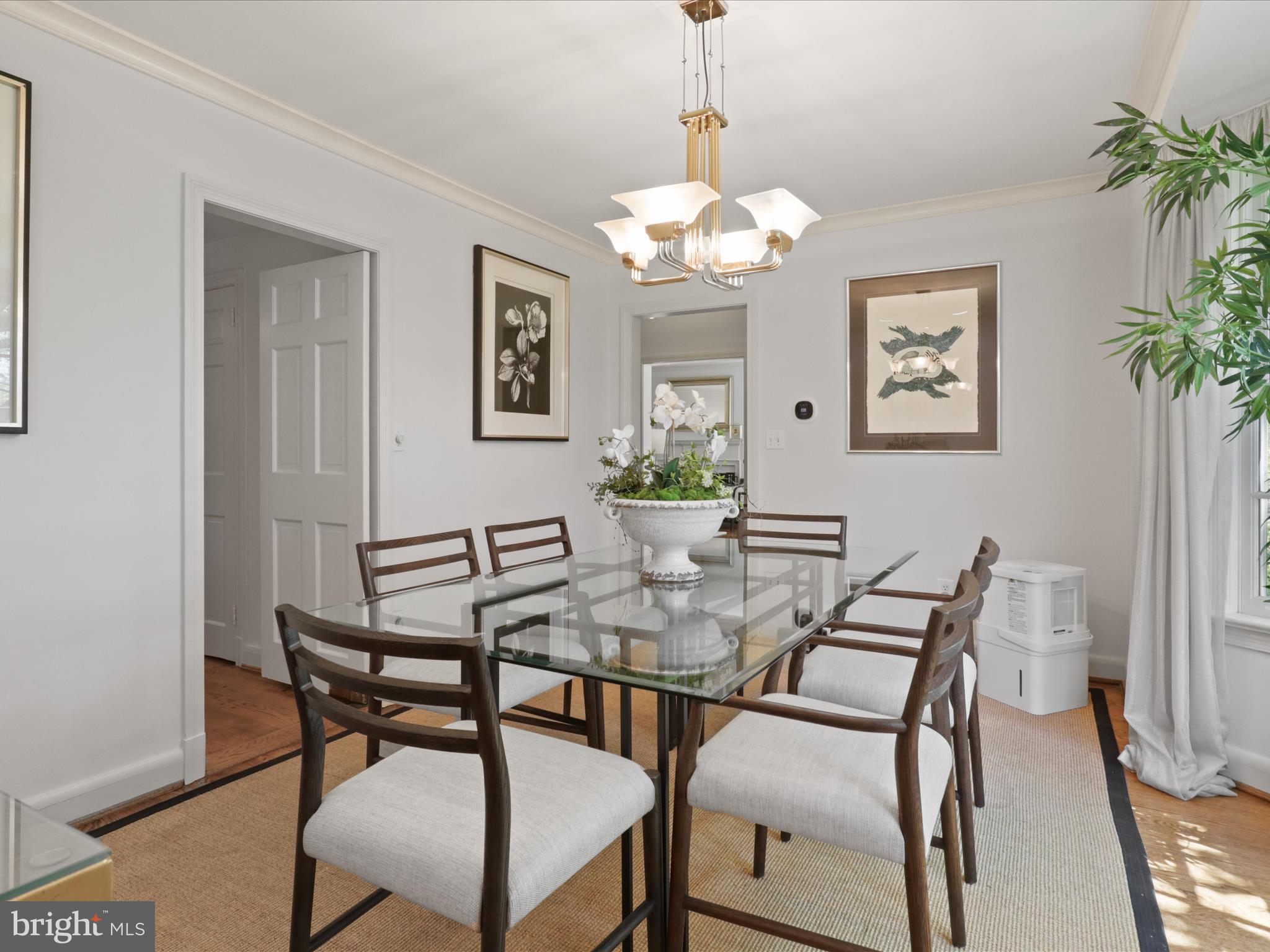 4725 Rock Spring Road Arlington, VA 22207 - Photo 10 of 59 a view of a dining room with furniture wooden floor and a chandelier