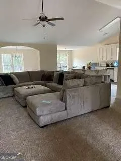 a living room with furniture and a window