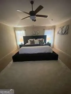 a bedroom with a bed and window