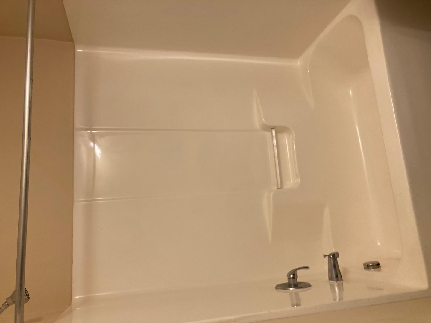 1501 Graduate Lane, Unit 103 Raleigh, NC 27606 - Photo 3 of 9 a bathroom with a bathtub