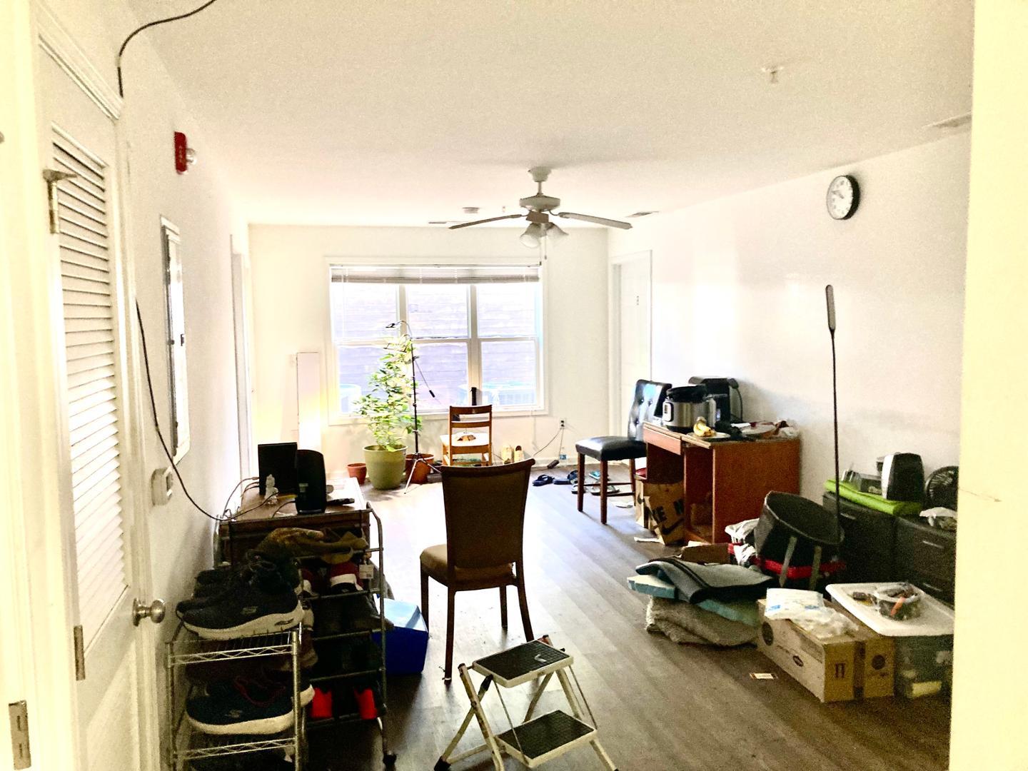 1501 Graduate Lane, Unit 103 Raleigh, NC 27606 - Photo 7 of 9 a view of a livingroom with furniture and floor to ceiling window