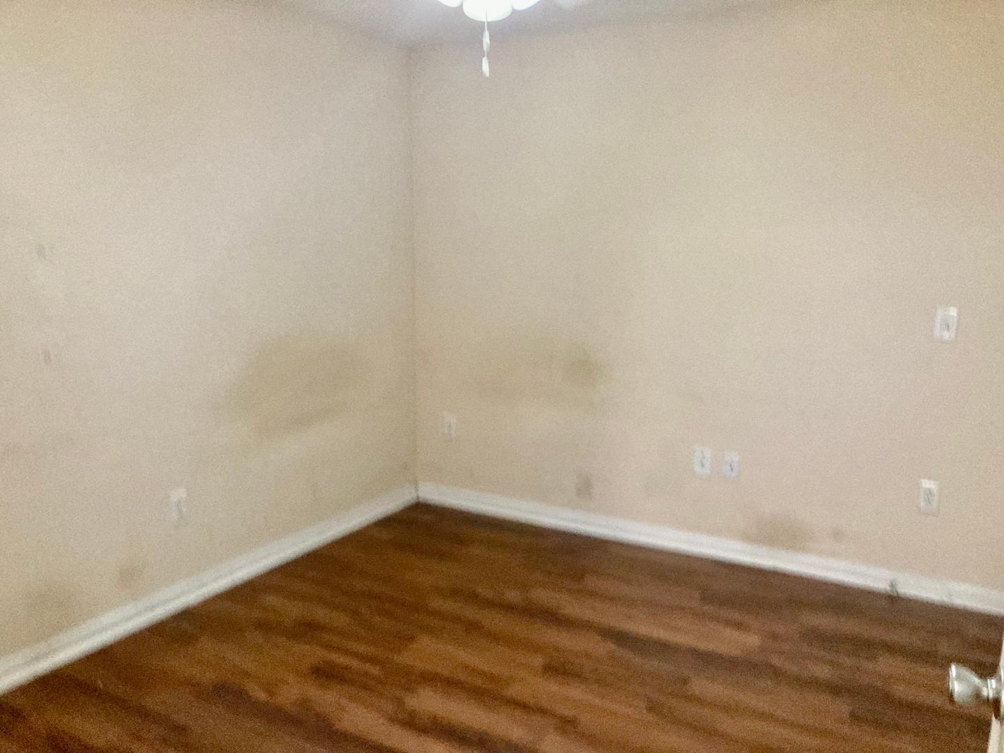 1501 Graduate Lane, Unit 103 Raleigh, NC 27606 - Photo 9 of 9 a view of an empty room with wooden floor