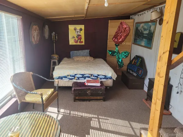 a bedroom with a bed and a table in it