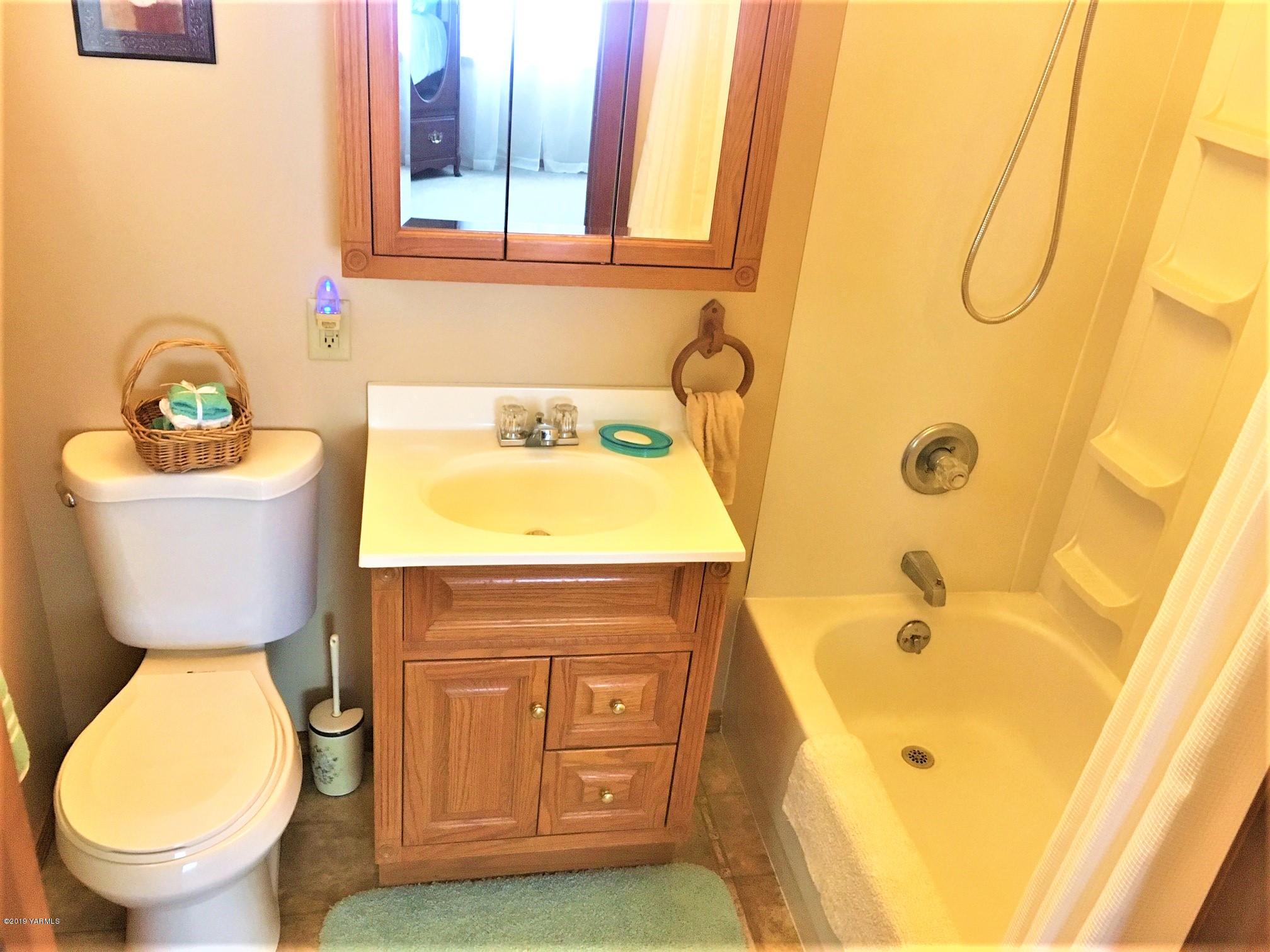 2060 Liberty Road Granger, WA 98932 - Photo 25 of 25 a bathroom with a sink and a toilet