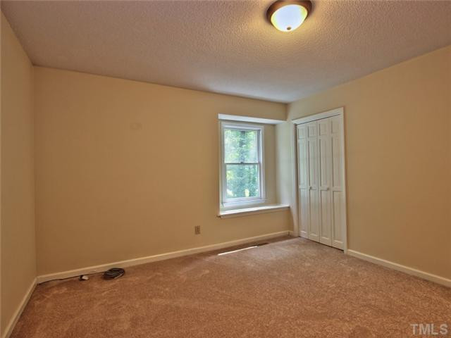 2701 Smokey Ridge Road Raleigh, NC 27613 - Photo 14 of 25 Third bedroom has a window seat, new carpet Bedroom