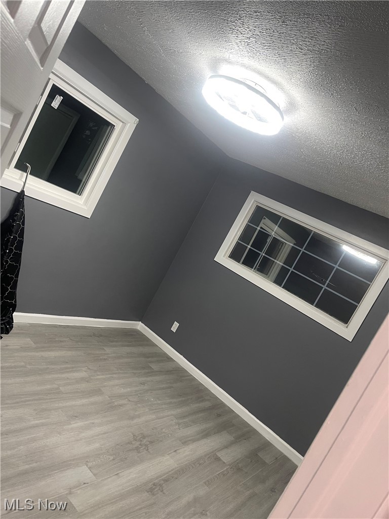 603 Liberty Road Youngstown, OH 44505 - Photo 15 of 42 Empty room featuring a textured ceiling and light wood-style floors