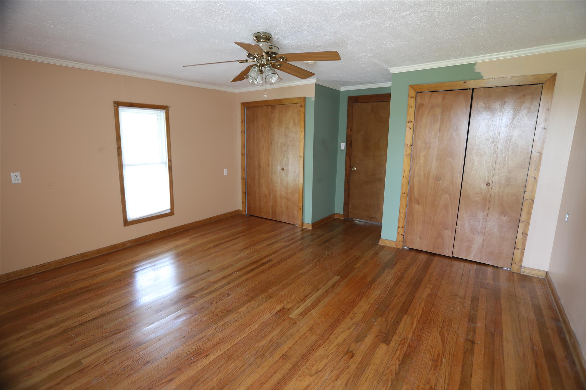 4651 Joe Peay Road Spring Hill, TN 37174 - Photo 11 of 28 a view of an empty room with wooden floor and a window