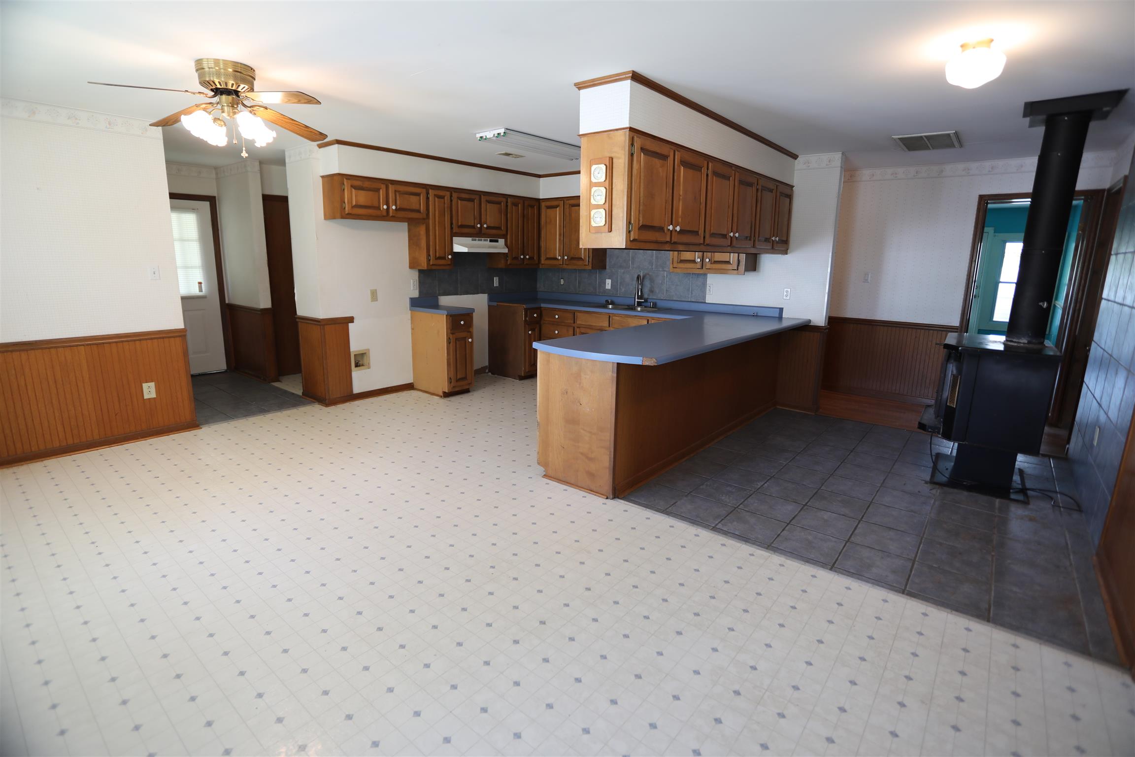 4651 Joe Peay Road Spring Hill, TN 37174 - Photo 13 of 28 a kitchen with refrigerator and cabinets