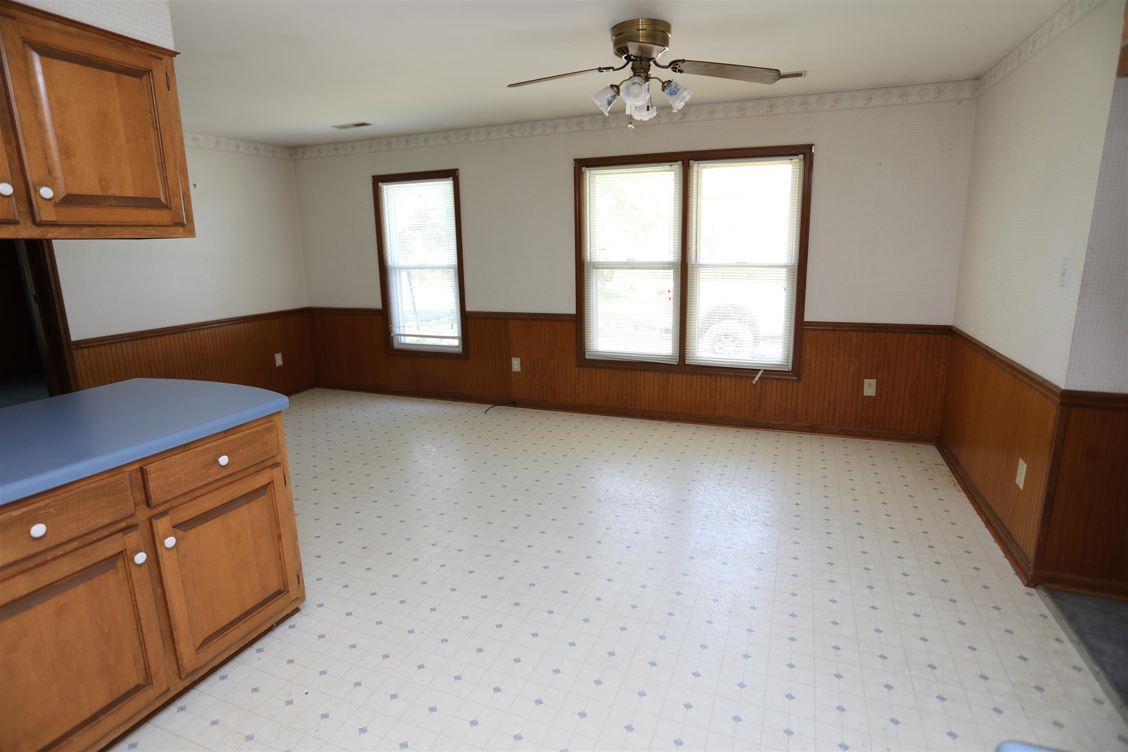 4651 Joe Peay Road Spring Hill, TN 37174 - Photo 15 of 28 an empty room with windows and cabinet