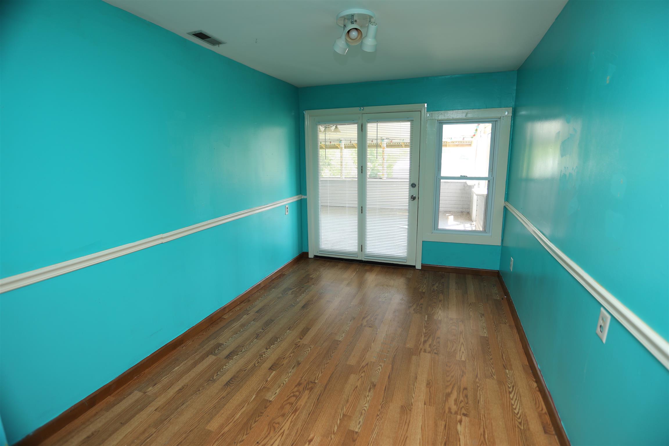 4651 Joe Peay Road Spring Hill, TN 37174 - Photo 17 of 28 a view of an empty room with wooden floor and a window