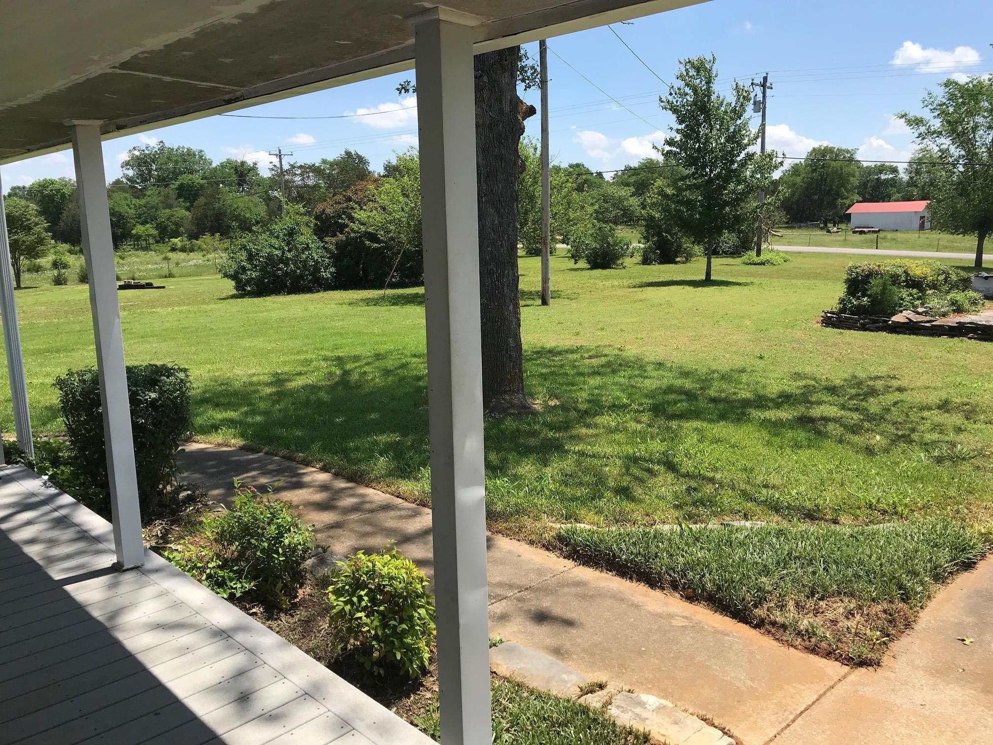 4651 Joe Peay Road Spring Hill, TN 37174 - Photo 3 of 28 a view of a yard with potted plants