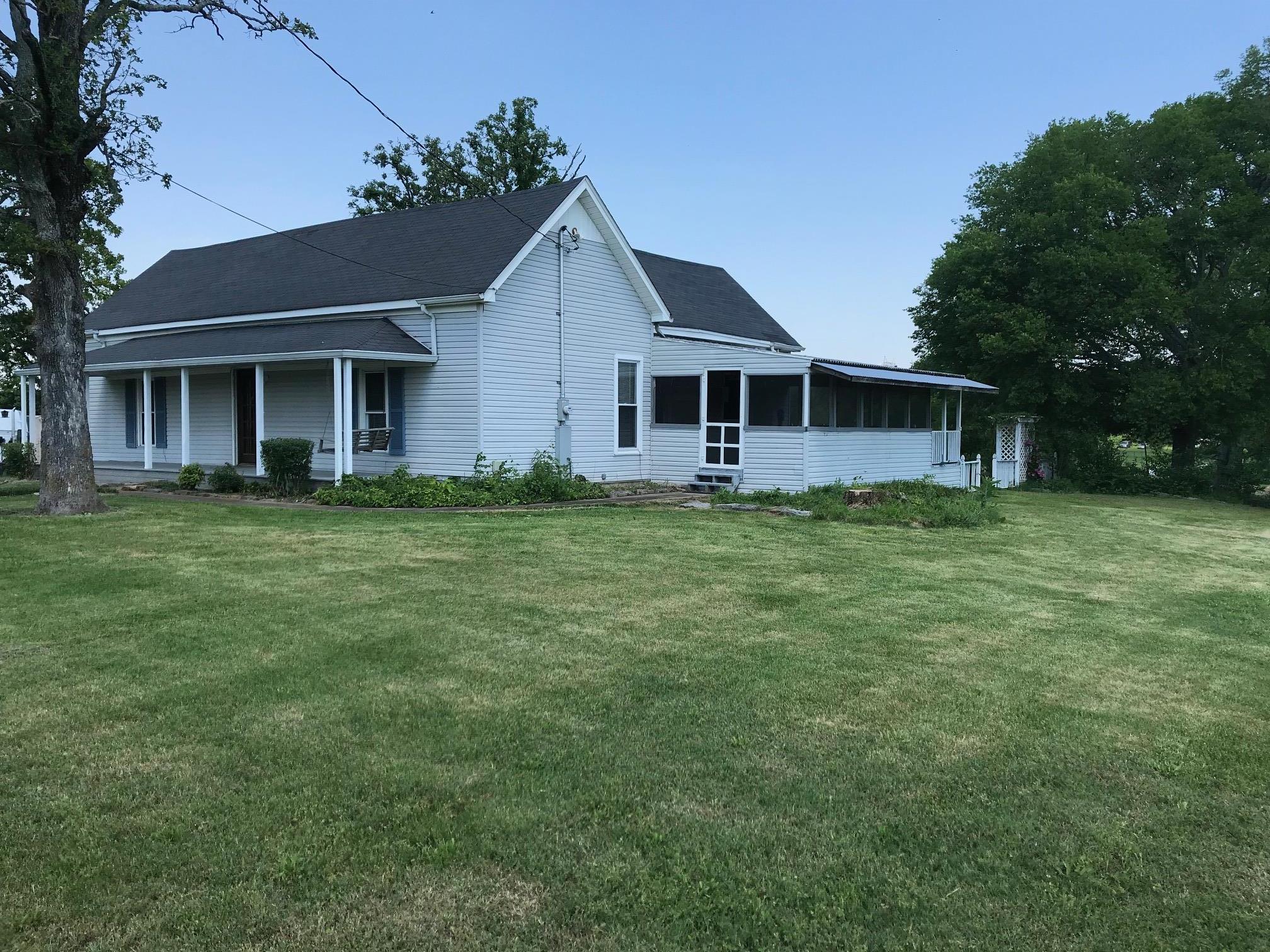 4651 Joe Peay Road Spring Hill, TN 37174 - Photo 5 of 28 a front view of a house with a garden