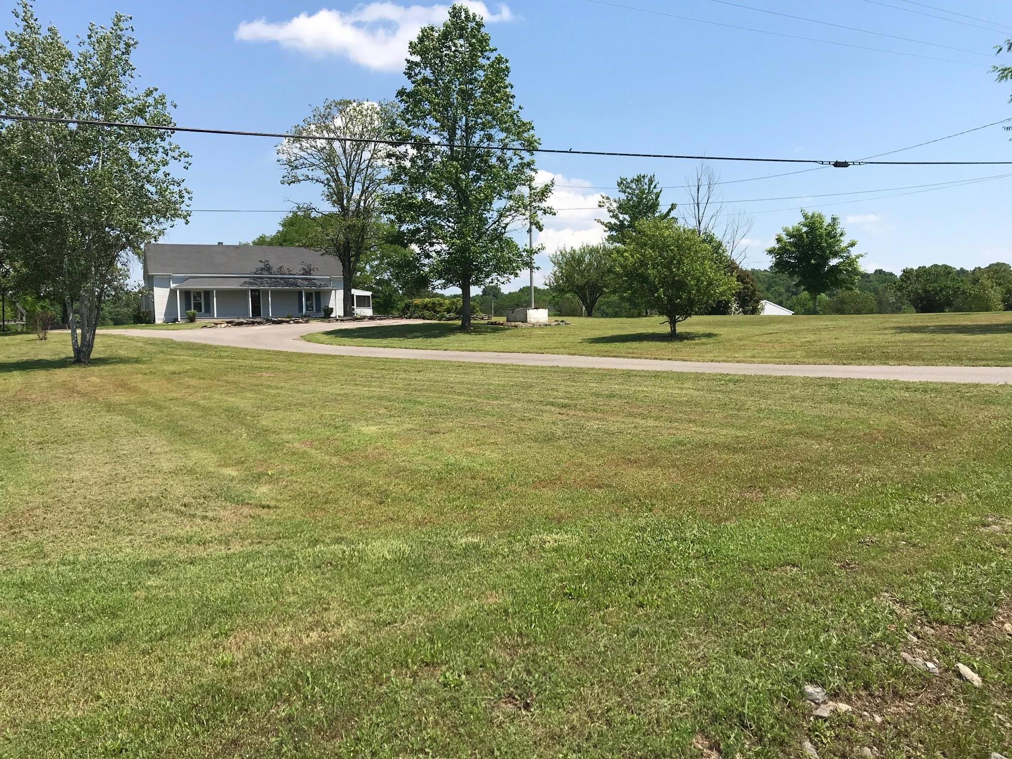 4651 Joe Peay Road Spring Hill, TN 37174 - Photo 7 of 28 a front view of a house with a yard
