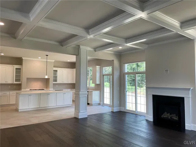 a view of a kitchen with a sink and a fireplace