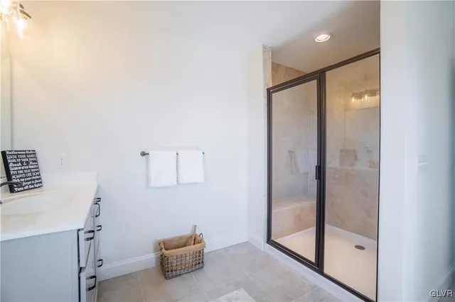 a bathroom with a shower and a sink