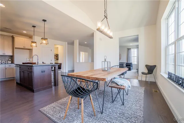 a very nice looking dining room with a table and chairs