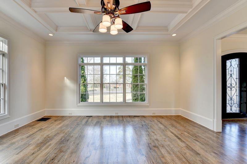 4045 Ridge Road Buford, GA 30519 - Photo 11 of 97 a view of an empty room with wooden floor and a window