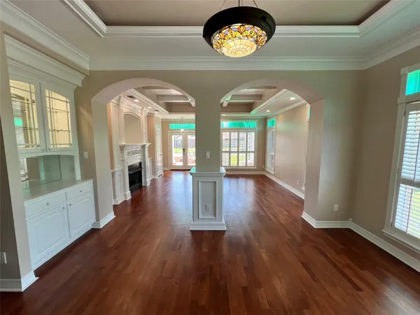 a view of an entryway with wooden floor