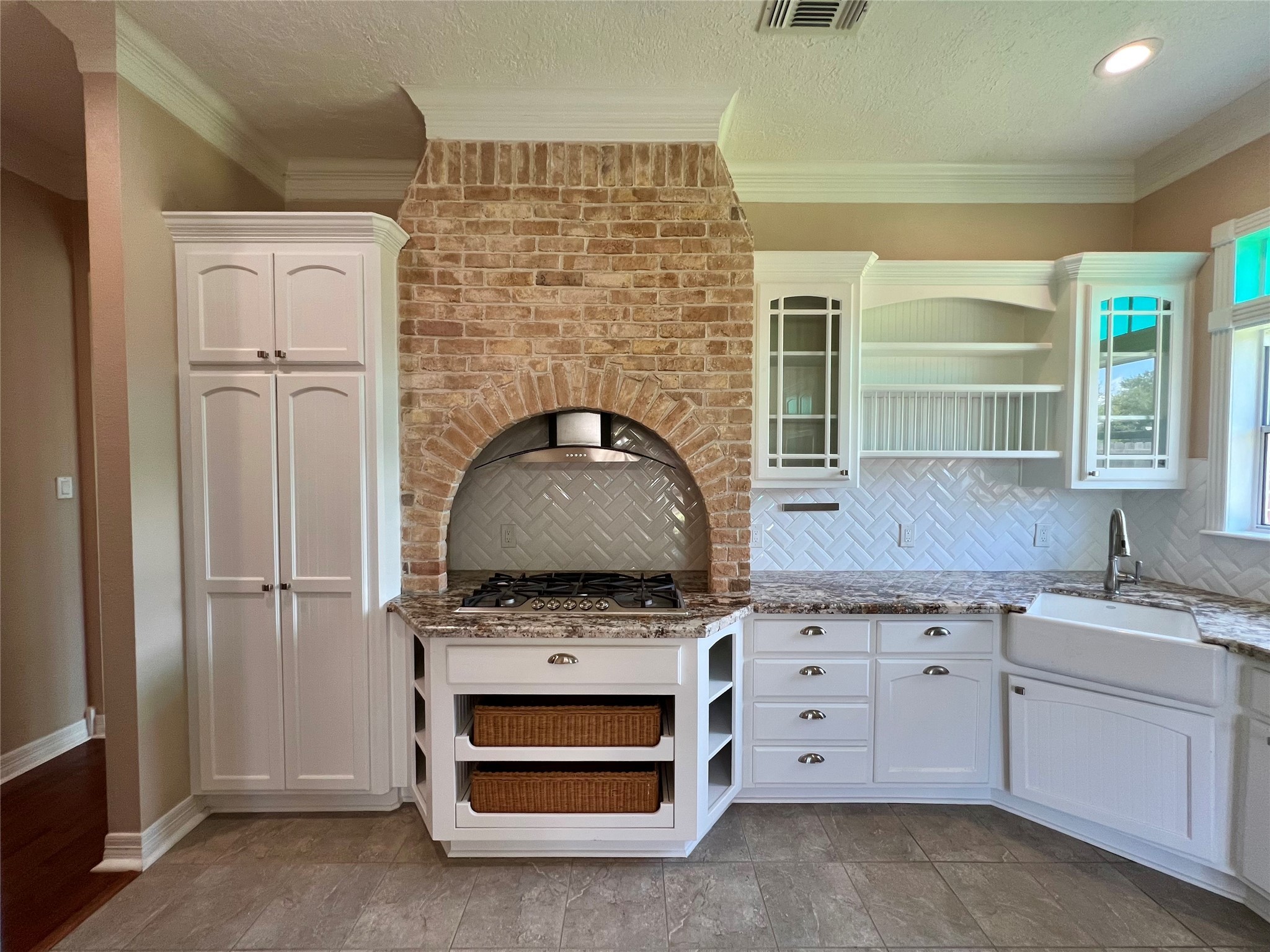341 Lasso Street Angleton, TX 77515 - Photo 12 of 49 a kitchen with stainless steel appliances granite countertop a stove and a sink