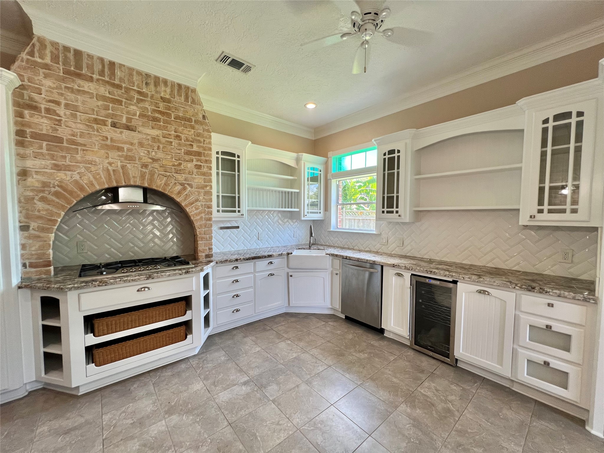 341 Lasso Street Angleton, TX 77515 - Photo 14 of 49 a kitchen with granite countertop a stove sink and cabinets