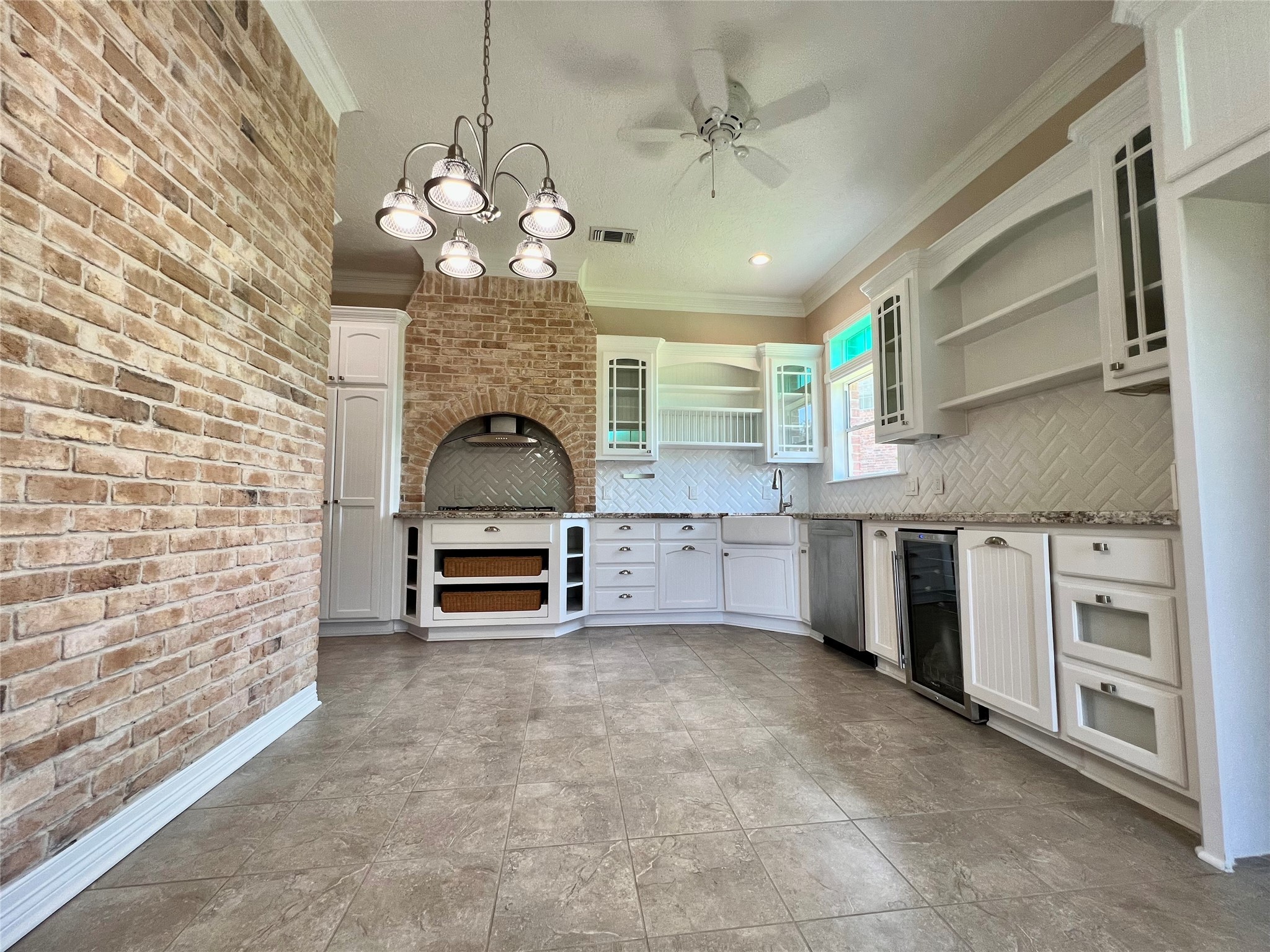 341 Lasso Street Angleton, TX 77515 - Photo 17 of 49 a large kitchen with stainless steel appliances granite countertop a stove and a sink