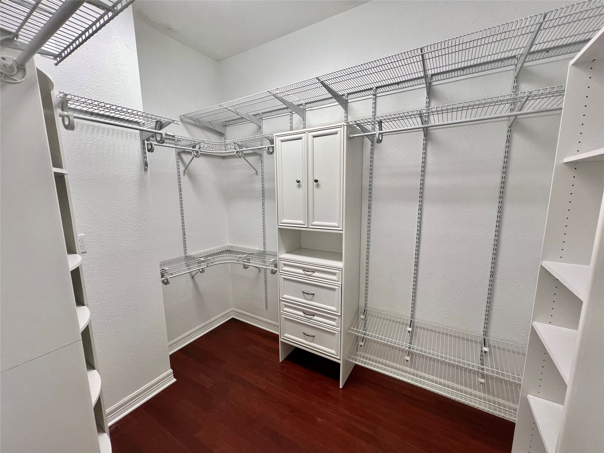 341 Lasso Street Angleton, TX 77515 - Photo 23 of 49 a view of walk in closet with empty racks