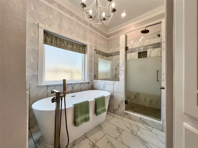 a spacious bathroom with a granite countertop sink a mirror and a shower