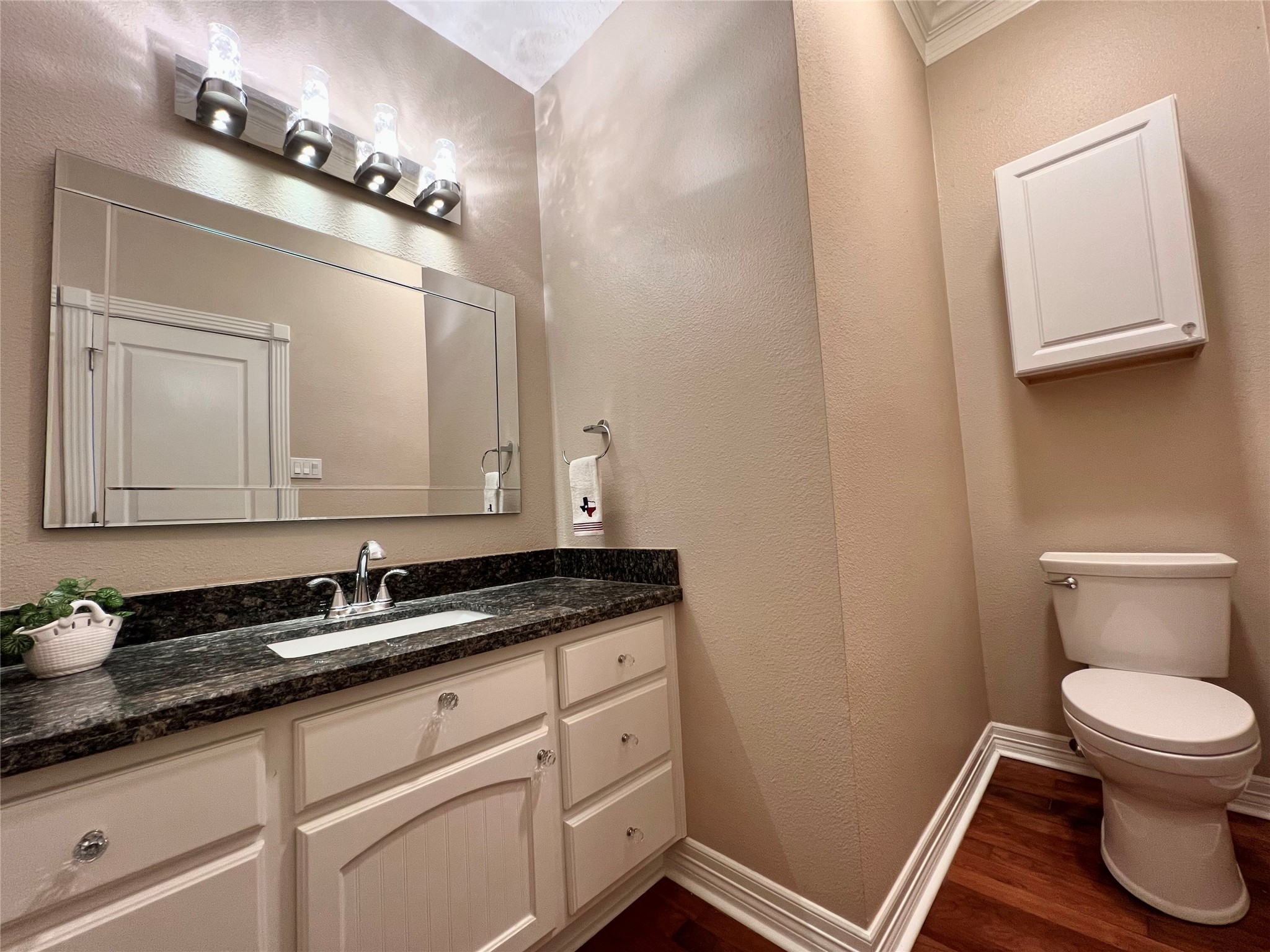 341 Lasso Street Angleton, TX 77515 - Photo 28 of 49 a bathroom with a granite countertop sink a toilet and mirror