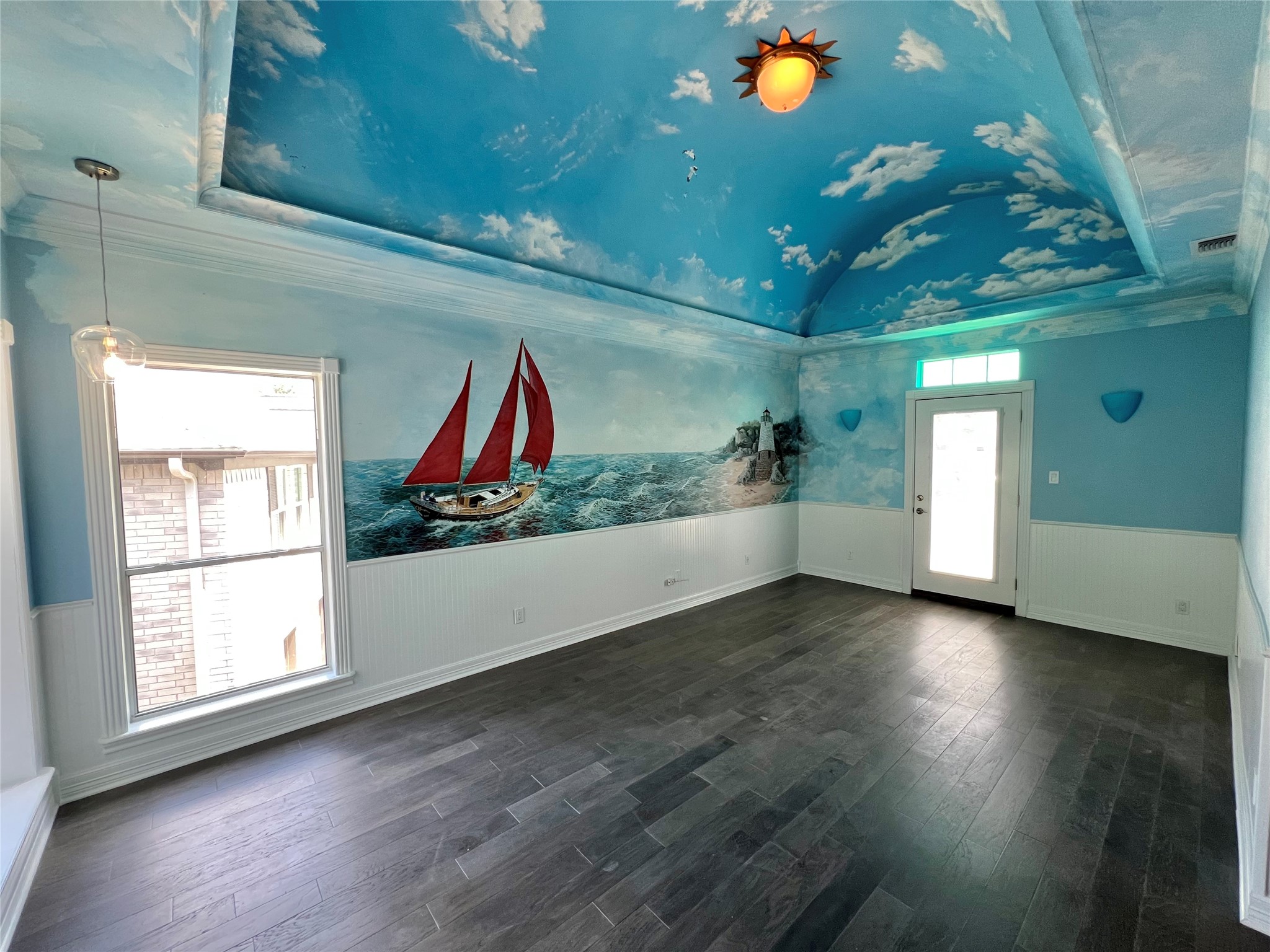 341 Lasso Street Angleton, TX 77515 - Photo 30 of 49 a view of an empty room with wooden floor and windows
