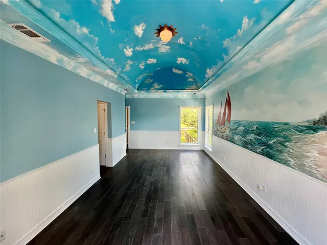 a backyard of a house with wooden floor