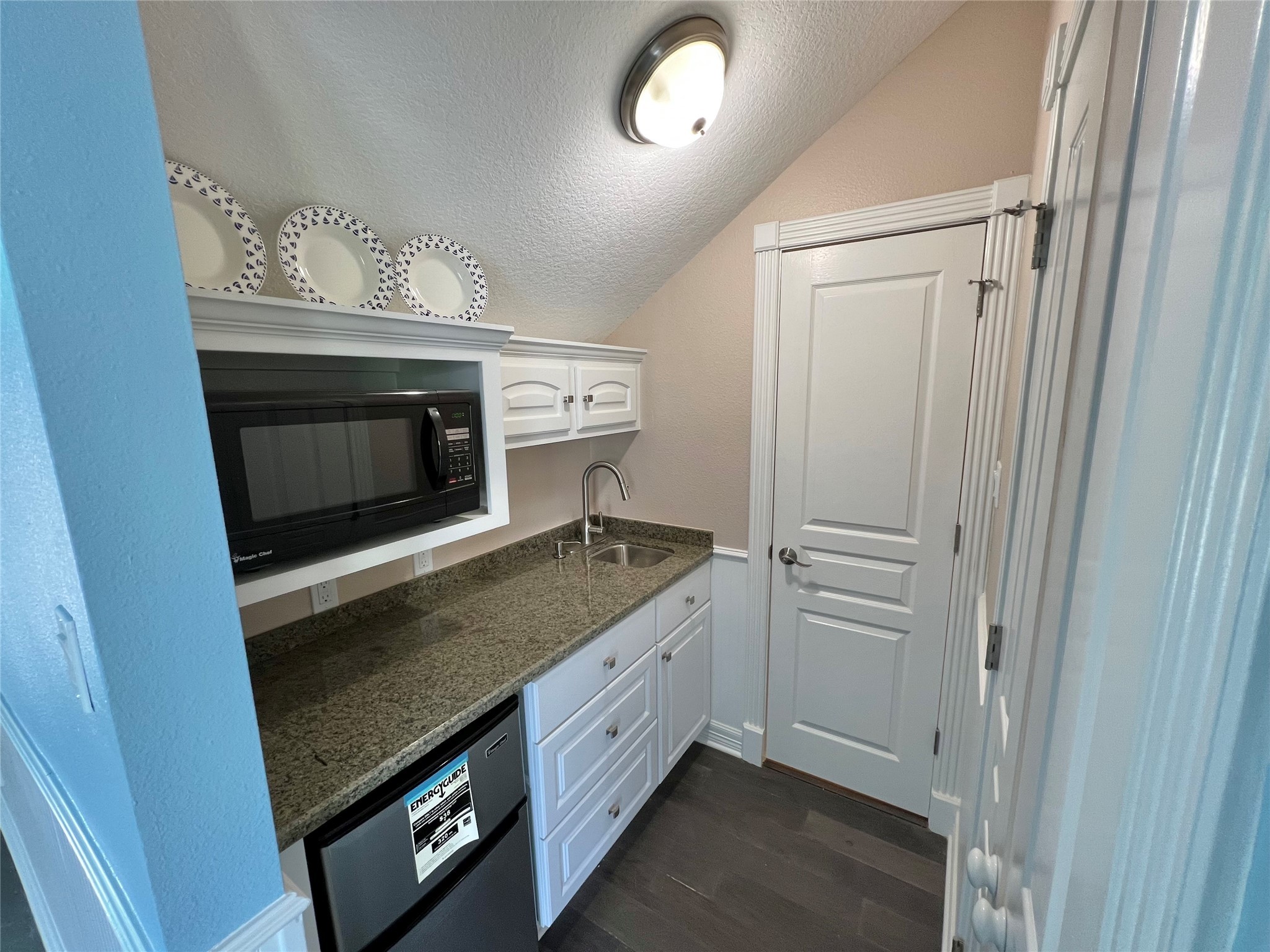 341 Lasso Street Angleton, TX 77515 - Photo 34 of 49 a kitchen with granite countertop a stove and a sink