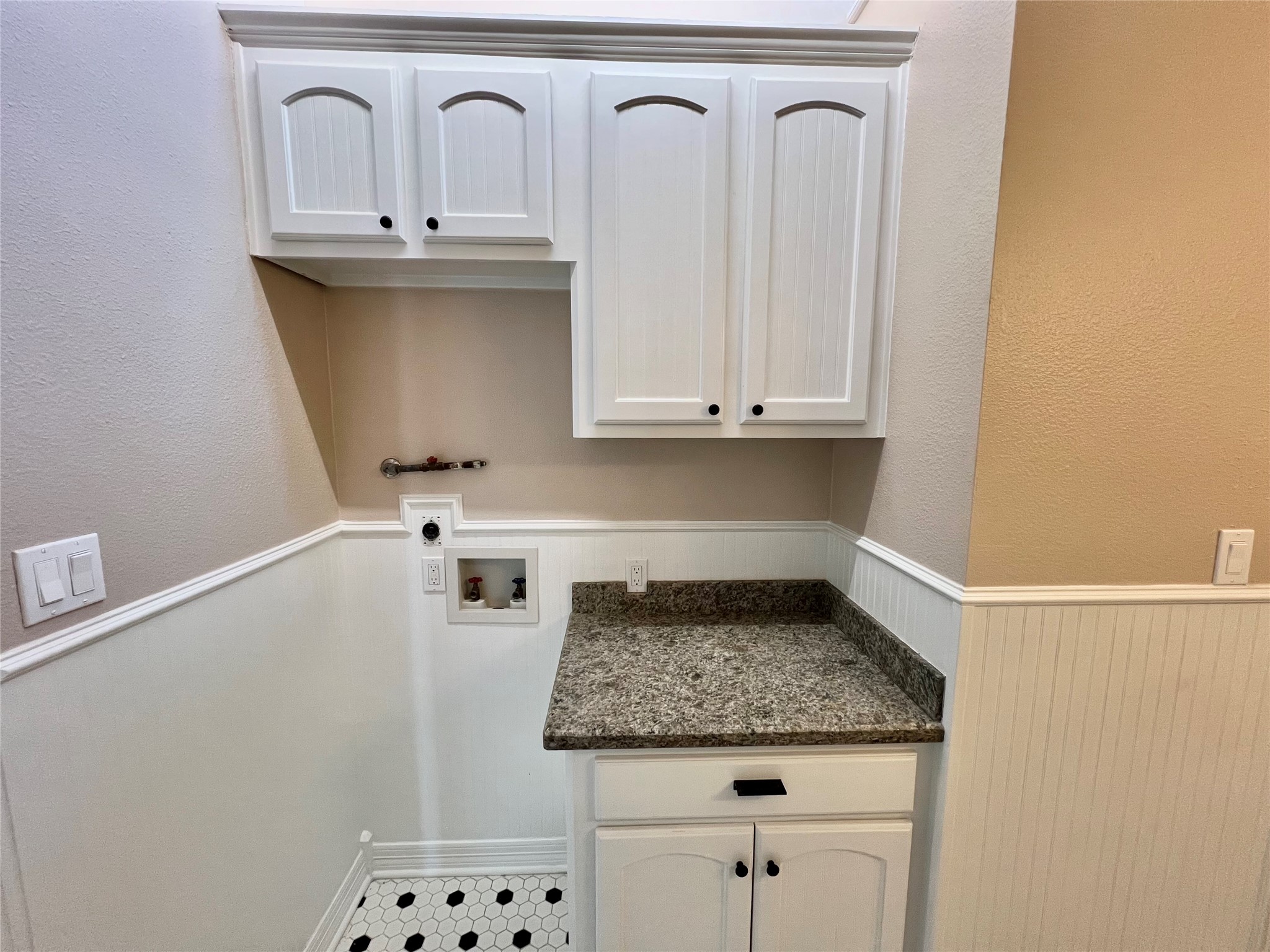 341 Lasso Street Angleton, TX 77515 - Photo 36 of 49 a utility room with granite countertop a sink a stove and cabinets