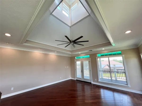 a view of a livingroom with a ceiling fan and window