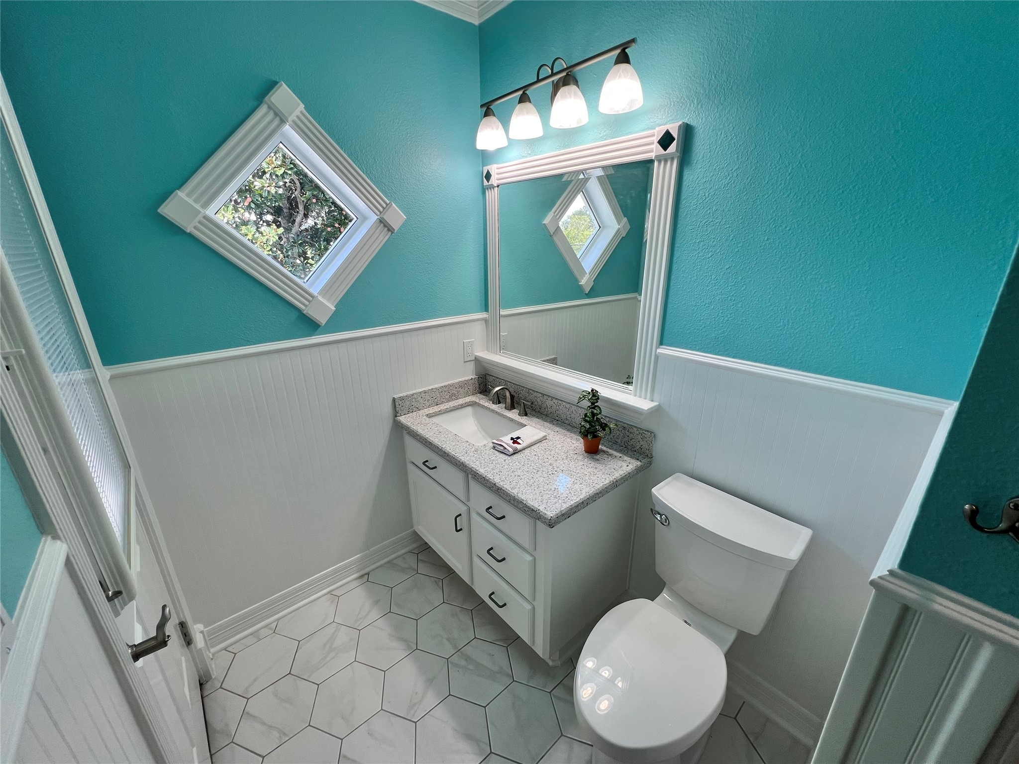 341 Lasso Street Angleton, TX 77515 - Photo 44 of 49 a bathroom with a toilet sink and mirror