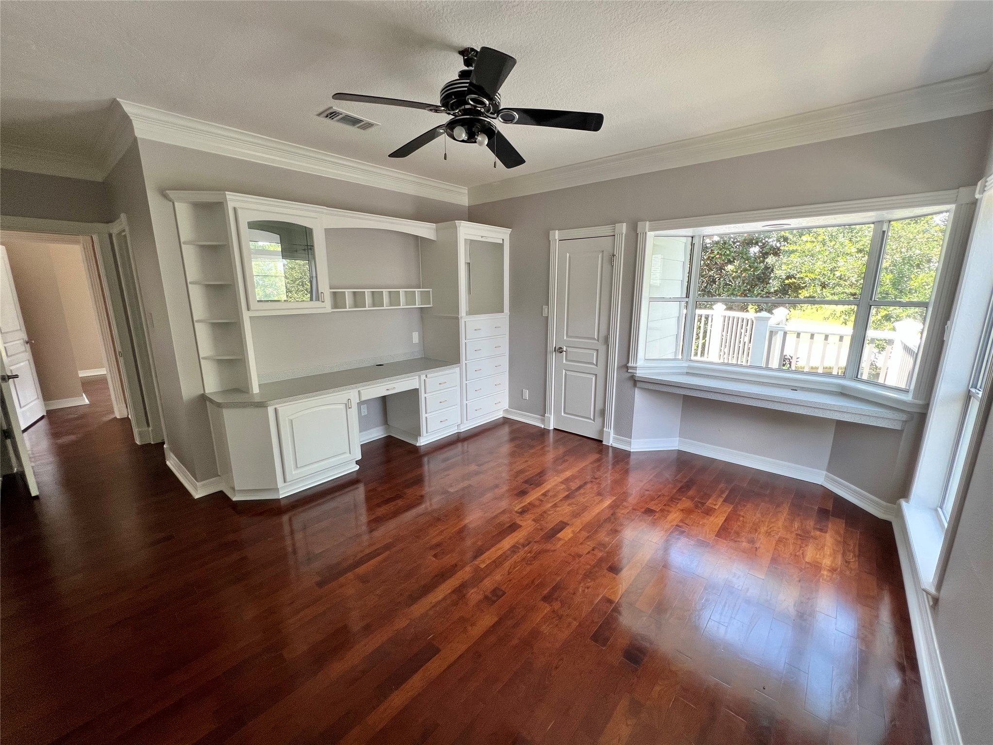 341 Lasso Street Angleton, TX 77515 - Photo 46 of 49 a view of an empty room with wooden floor and a window