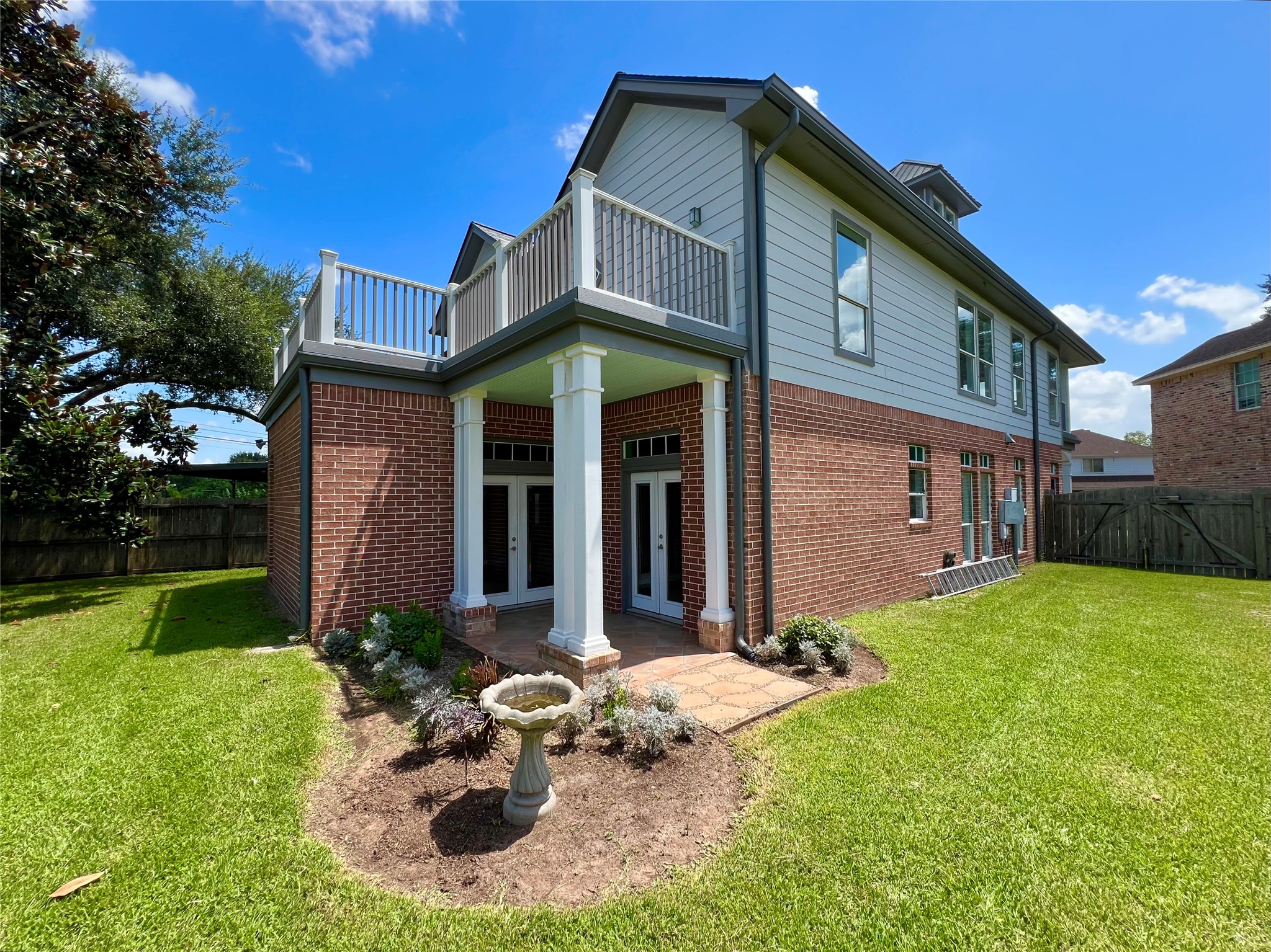 341 Lasso Street Angleton, TX 77515 - Photo 48 of 49 a front view of a house with garden