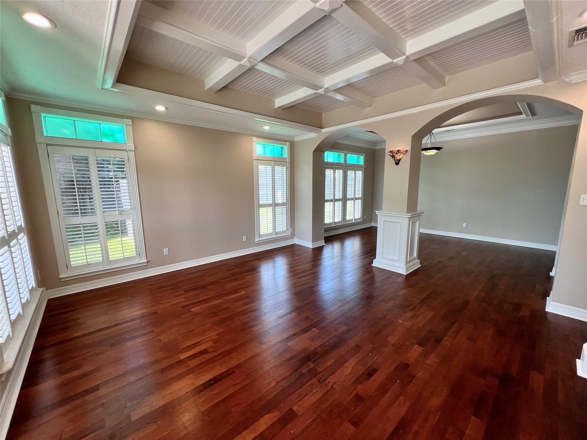 341 Lasso Street Angleton, TX 77515 - Photo 5 of 49 a view of an empty room with wooden floor and a window