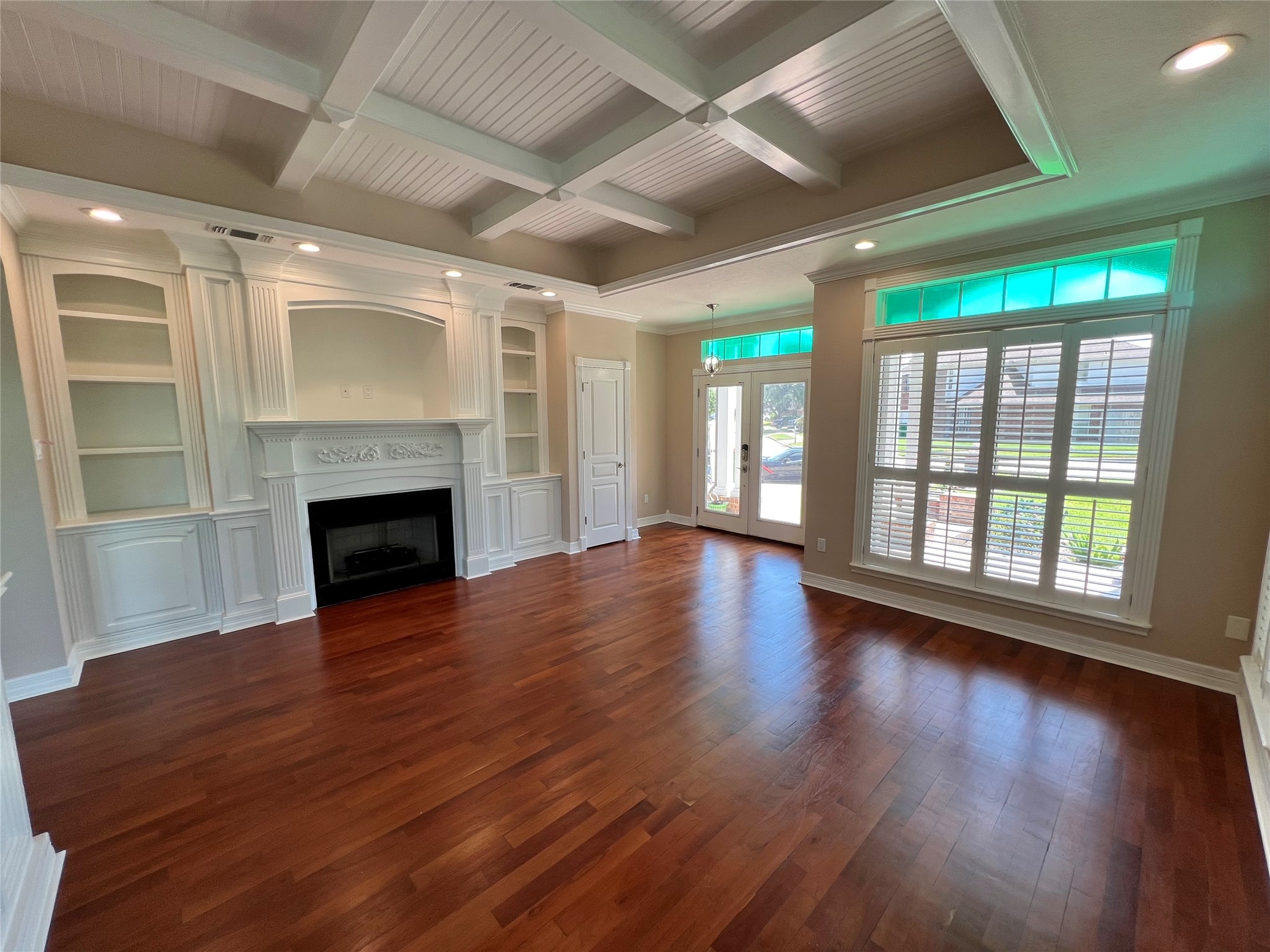 341 Lasso Street Angleton, TX 77515 - Photo 6 of 49 a view of empty room with wooden floor and fireplace