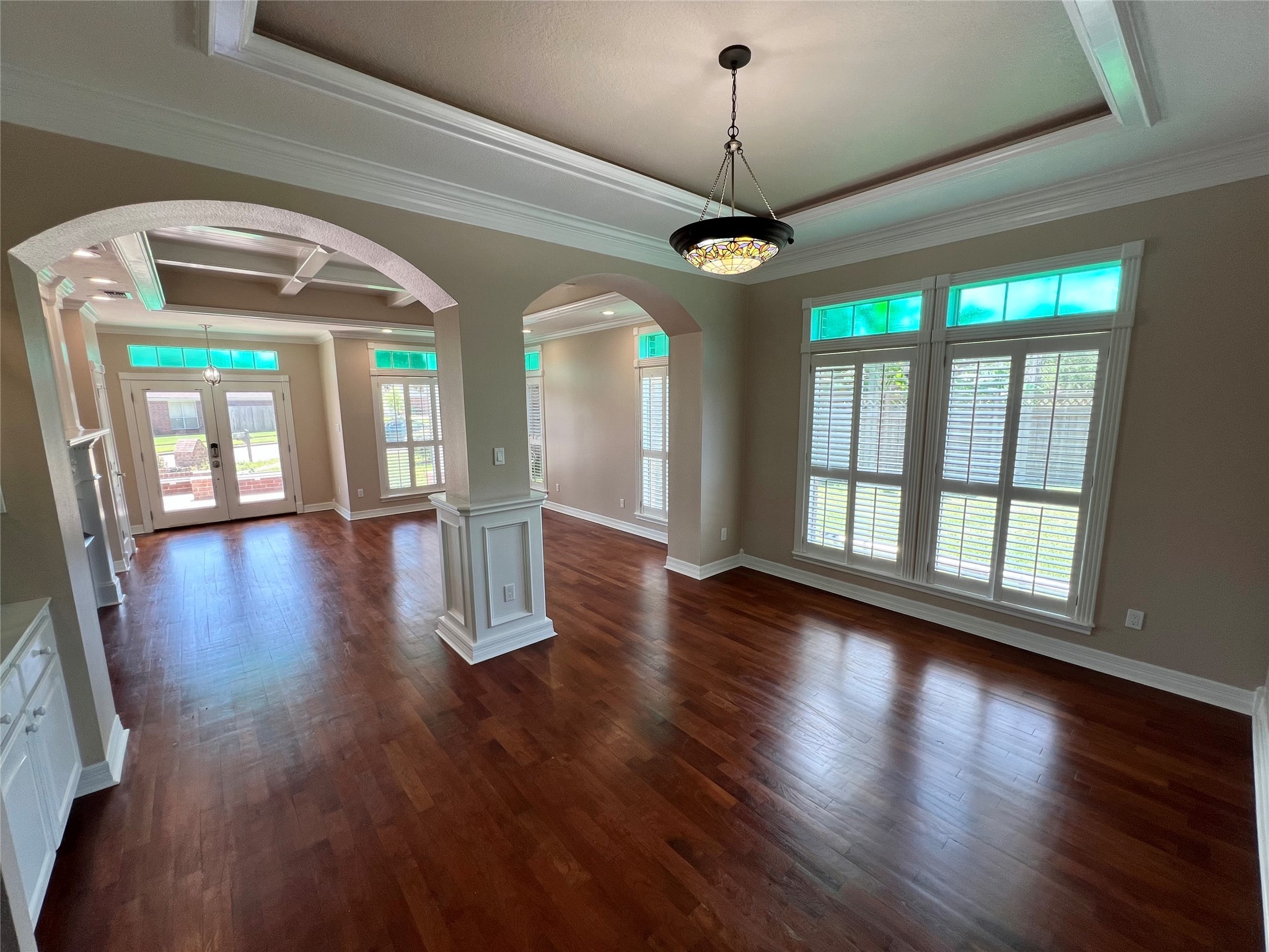 341 Lasso Street Angleton, TX 77515 - Photo 10 of 49 a view of a livingroom with wooden floor a ceiling fan and windows