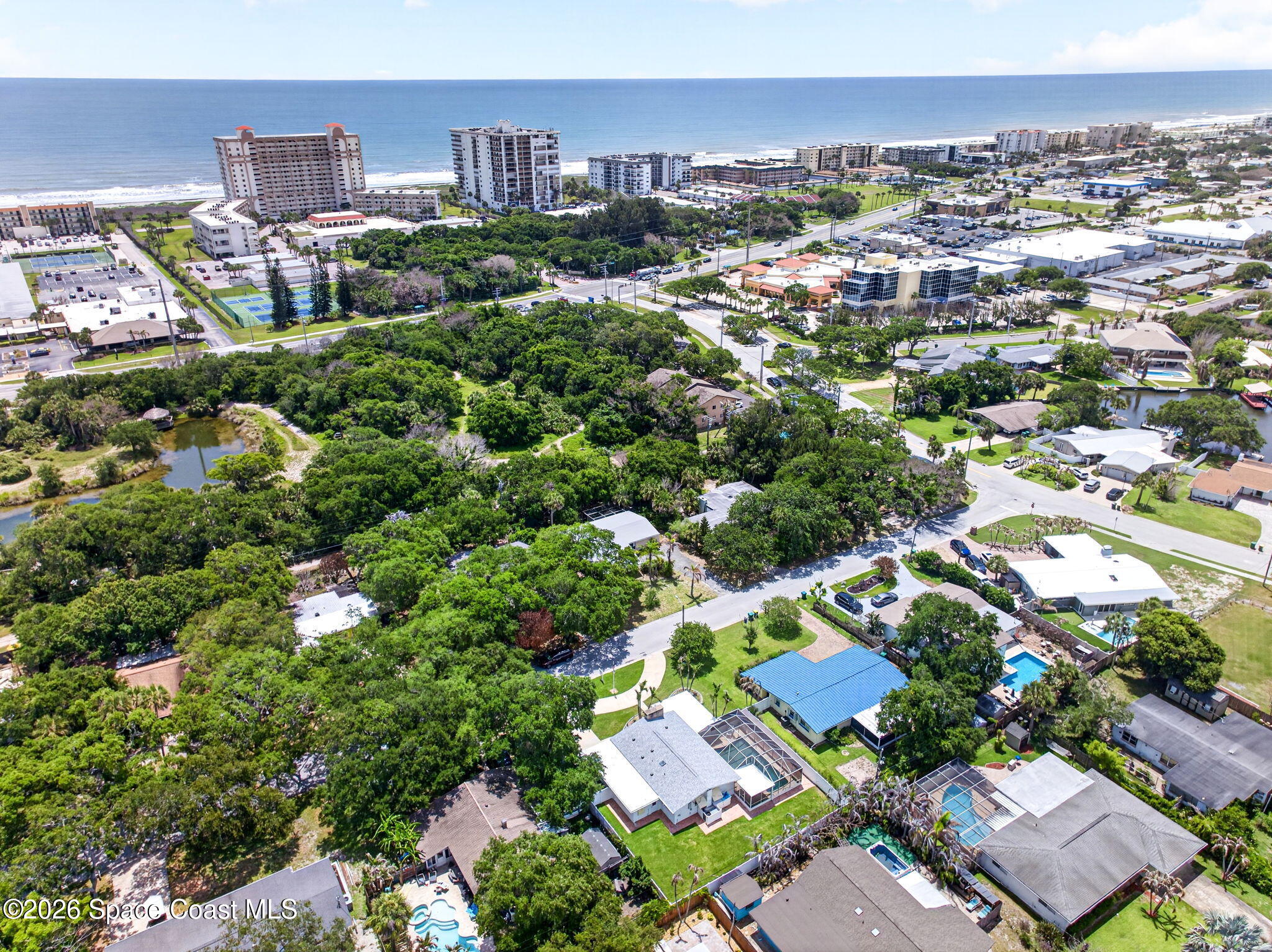 935 Samar Road Cocoa Beach, FL 32931 - Photo 2 of 22 an aerial view of residential houses with outdoor space and trees