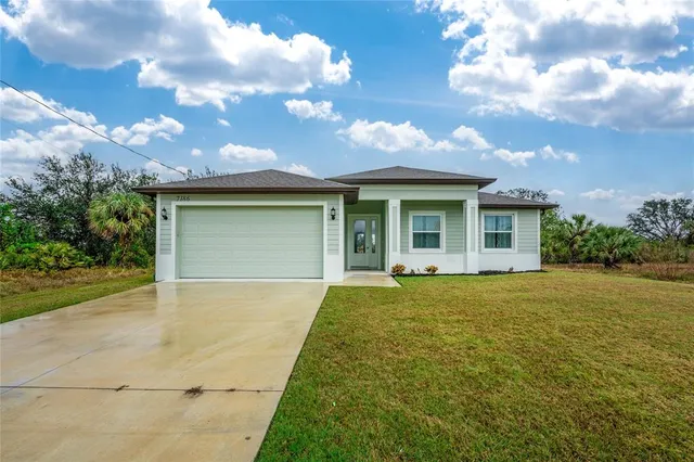 front view of a house with a garden