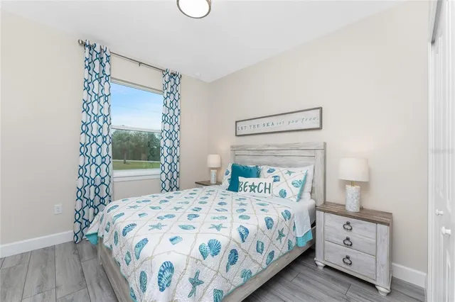 a bedroom with a bed and a mirror