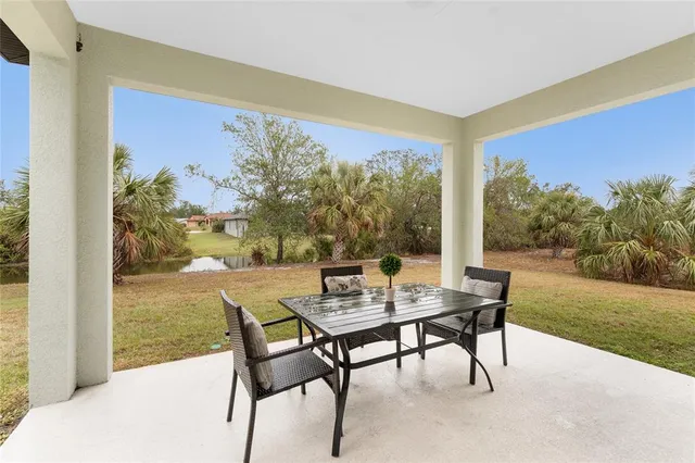 a view of a porch with dining table and chair