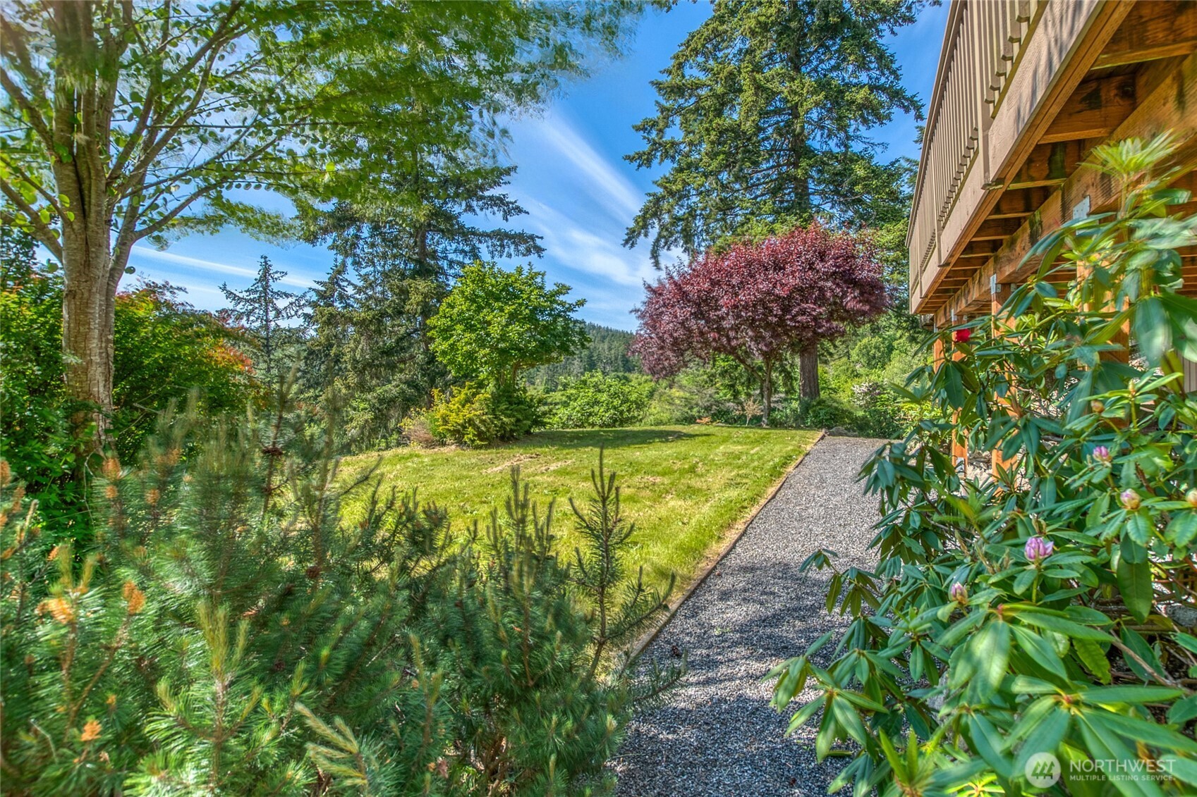 402 Cayou Valley Road Orcas Island, WA 98245 - Photo 15 of 40 a view of a large yard with plants and large trees