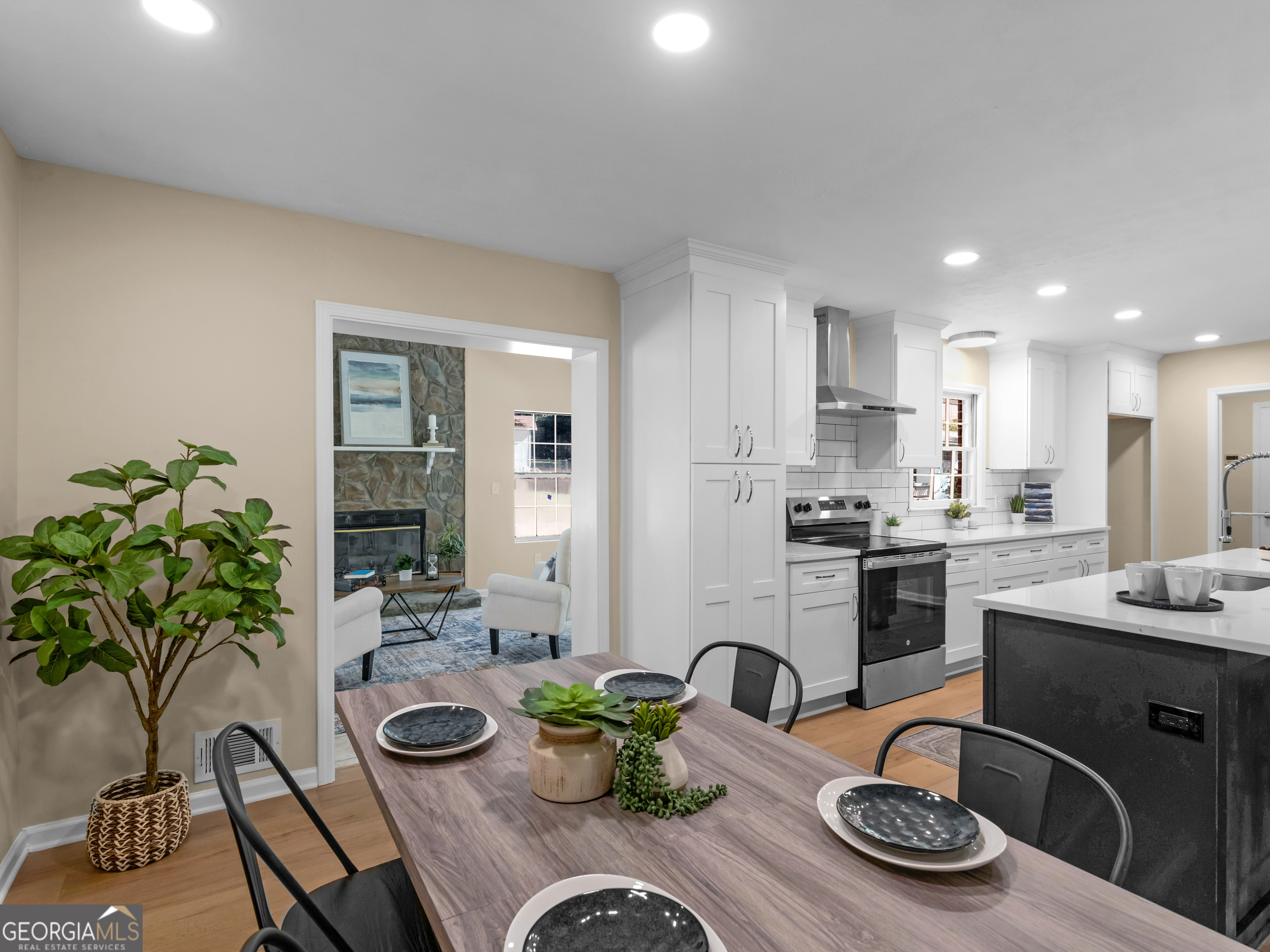 a kitchen with a table and chairs in it