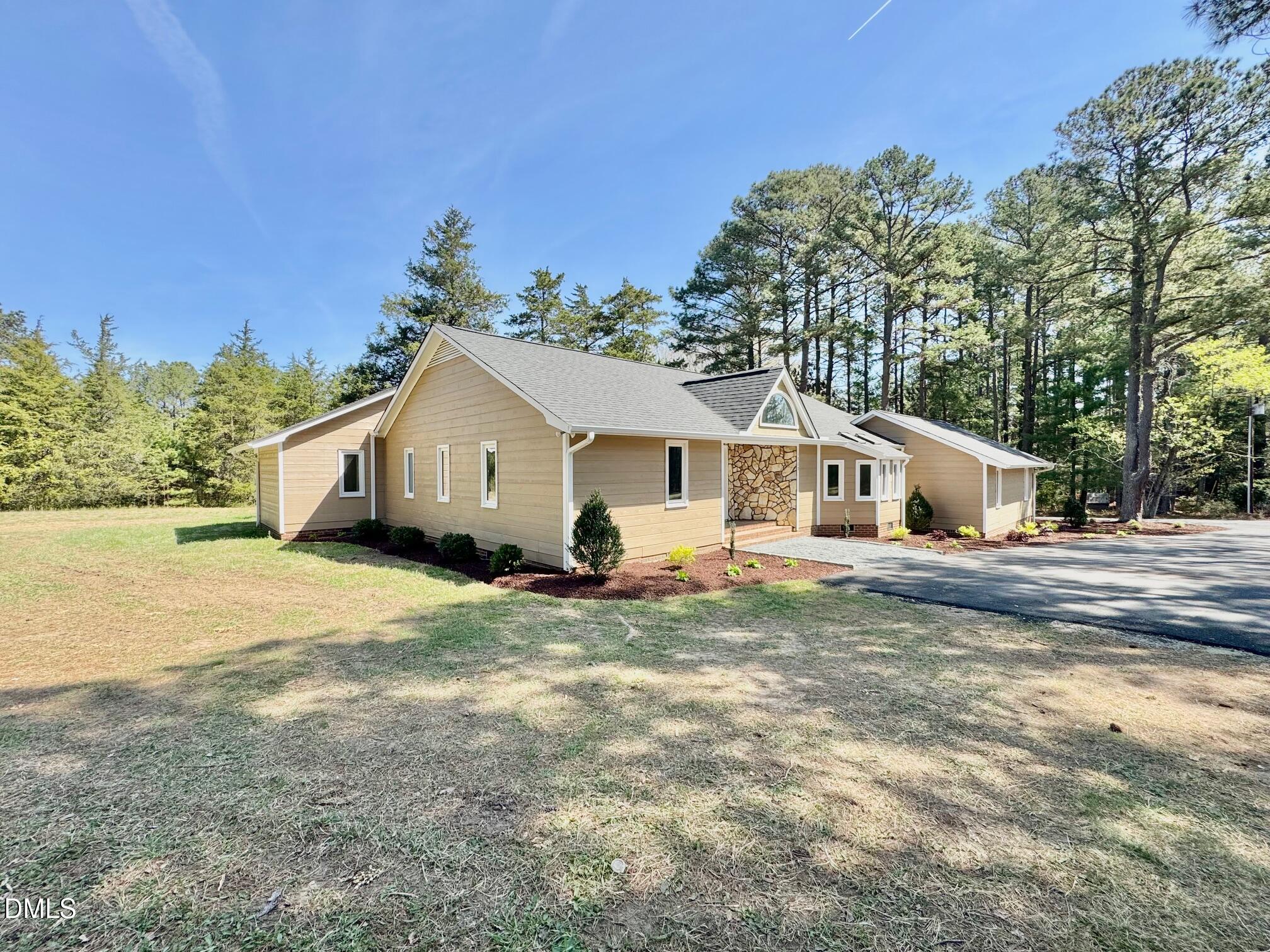 1720 Ross Mill Road Henderson, NC 27537 - Photo 7 of 42 a view of a house with a yard