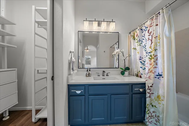 a bathroom with a double vanity sink mirror and double