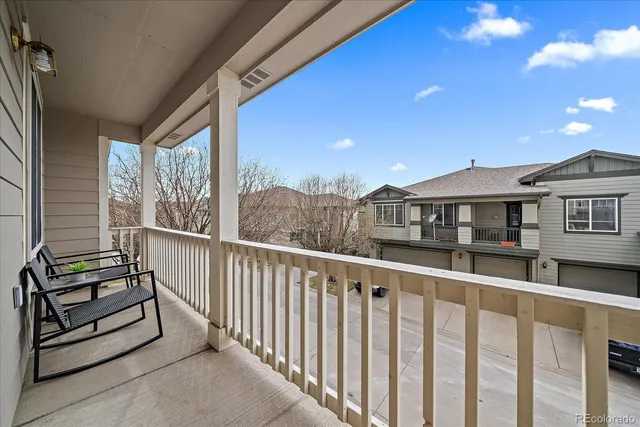 a balcony view with a city view