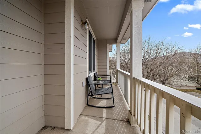 a view of a balcony with chairs